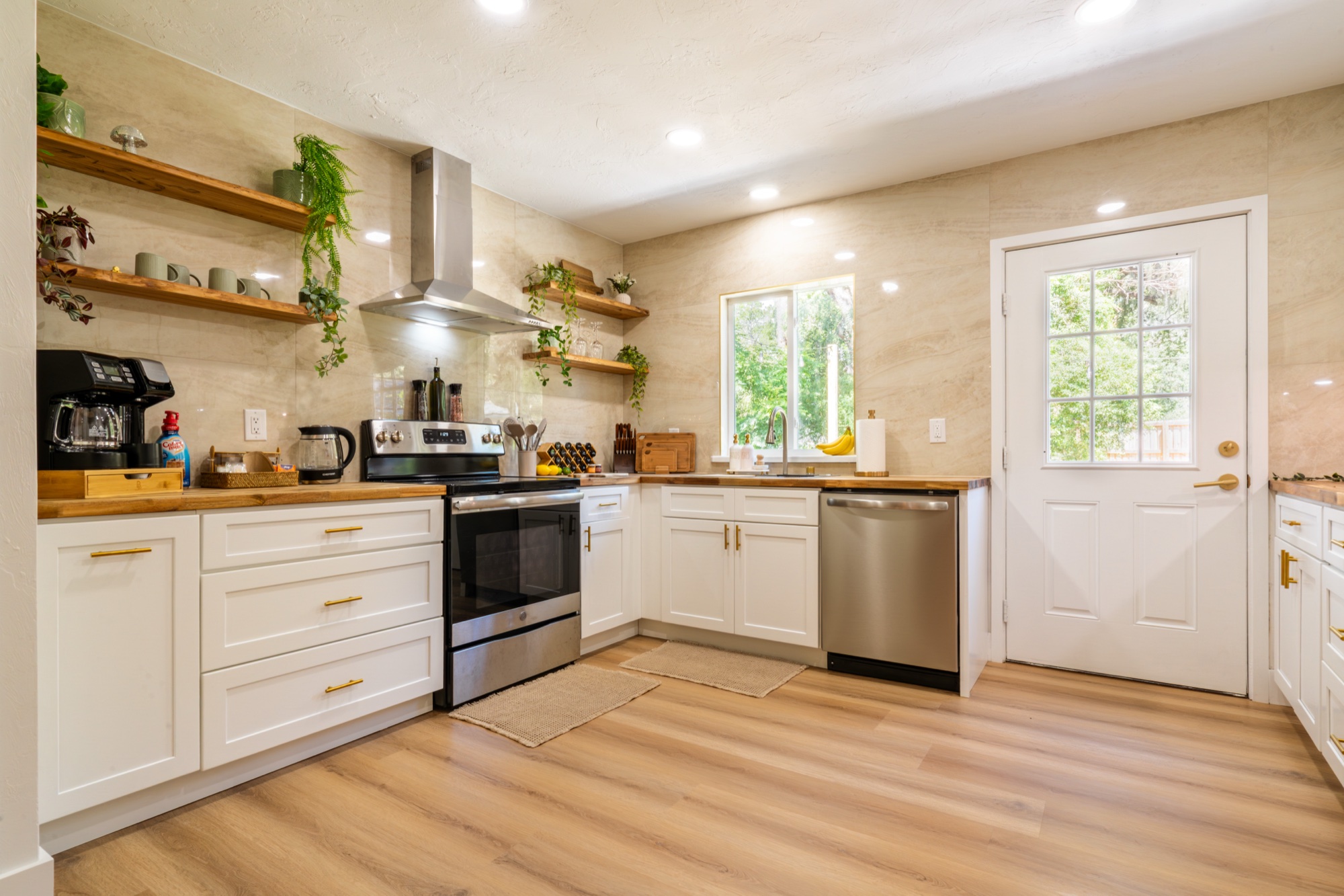 Kitchen with open wood shelving and butcher block counters
